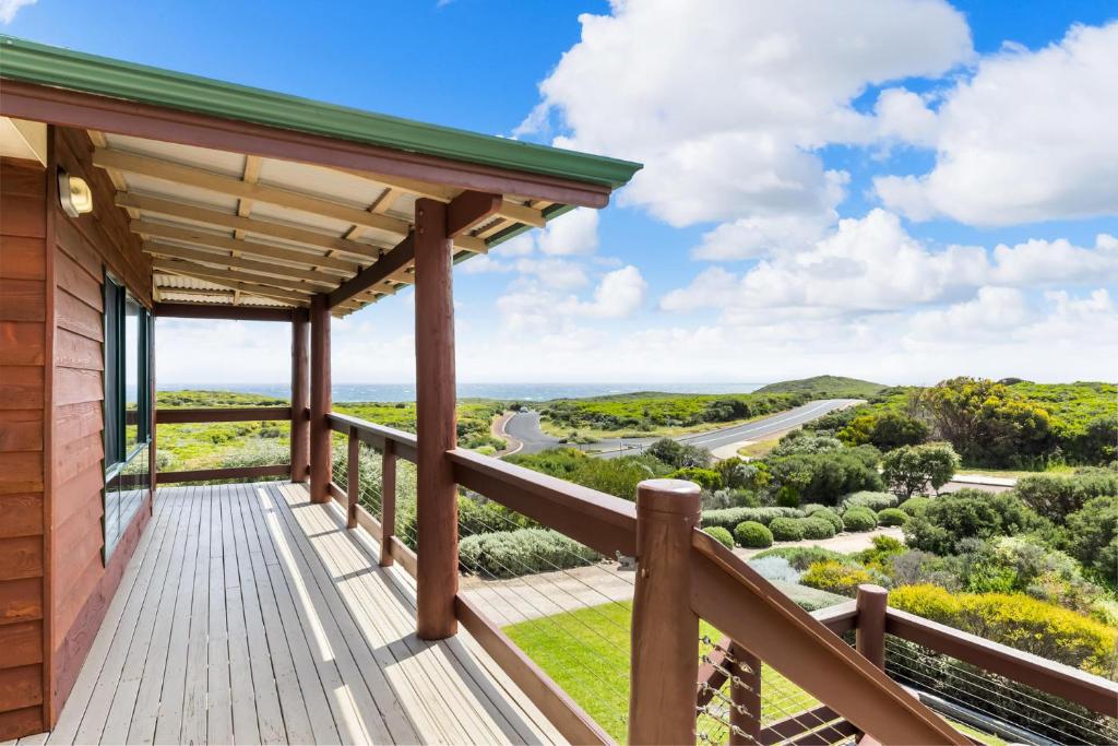 a view from the deck of a house at Red Door - Enjoy Exclusive Front Row Sunsets from the Balcony & Walks to the Surf in Gnarabup in Gnarabup