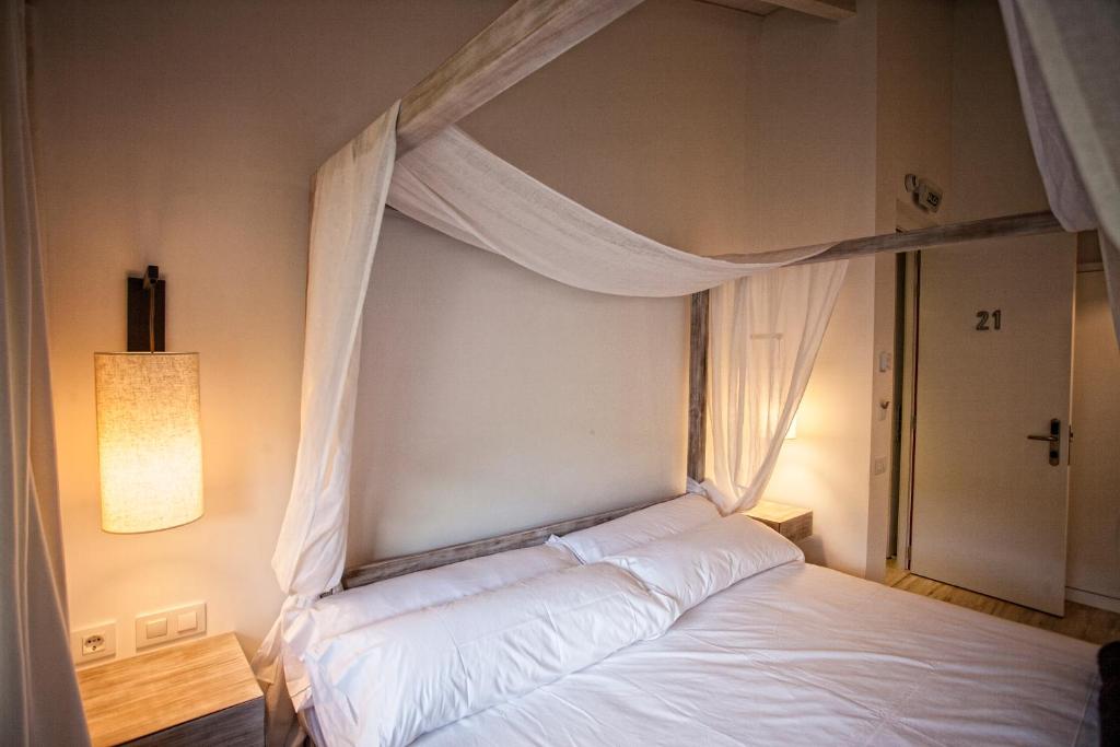 Posteľ alebo postele v izbe v ubytovaní Hotel Pura Vida