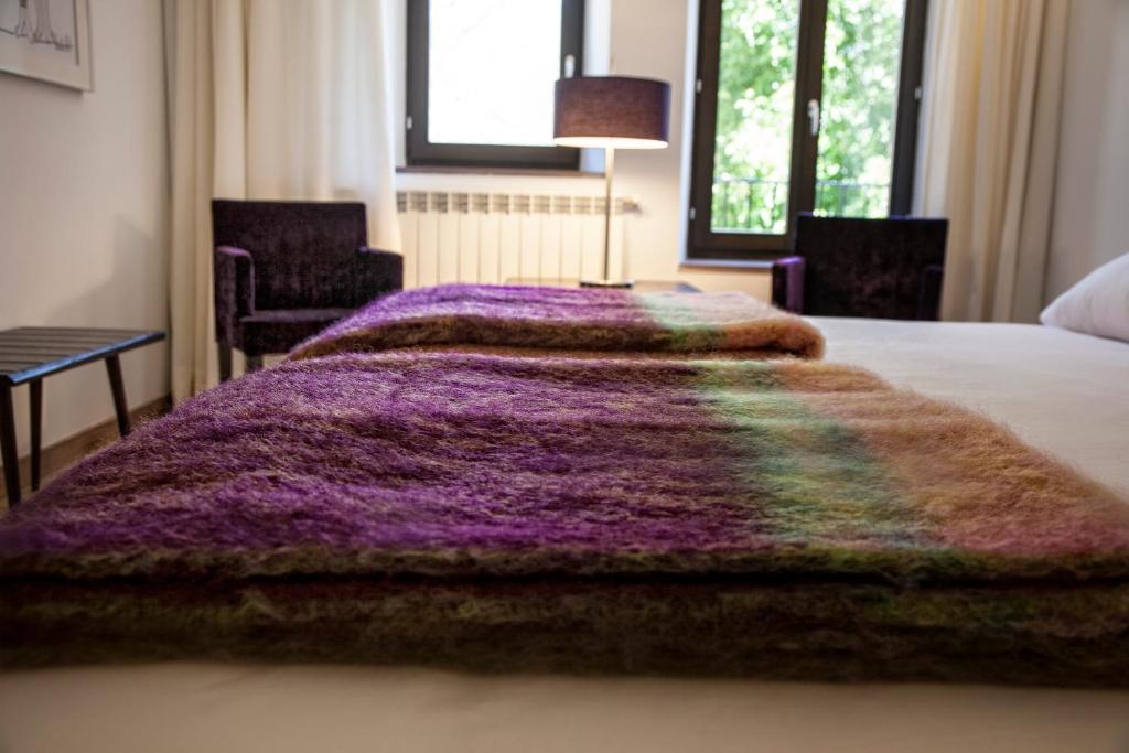 Posteľ alebo postele v izbe v ubytovaní Hotel Pura Vida