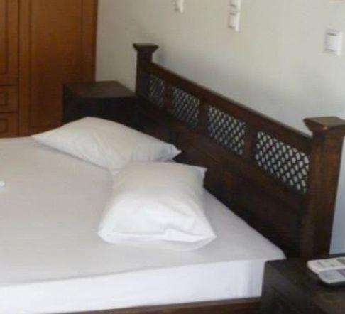 Postel nebo postele na pokoji v ubytování Hotel Korinthos