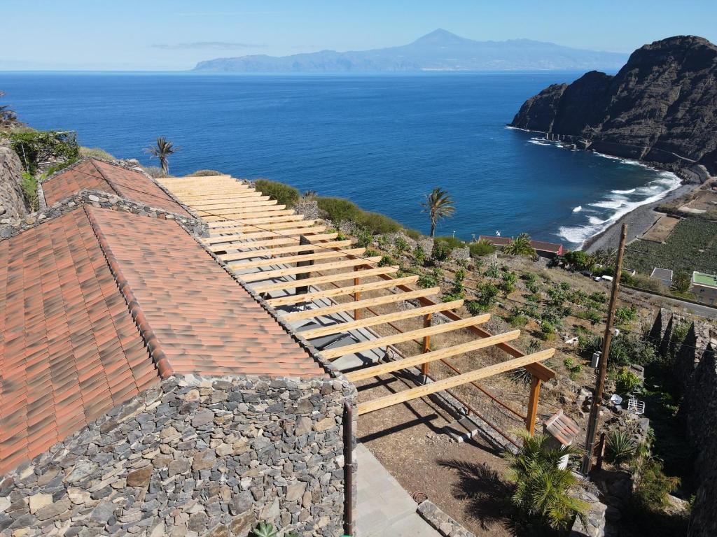 a set of stairs leading down to the ocean at Casa Sol in Hermigua