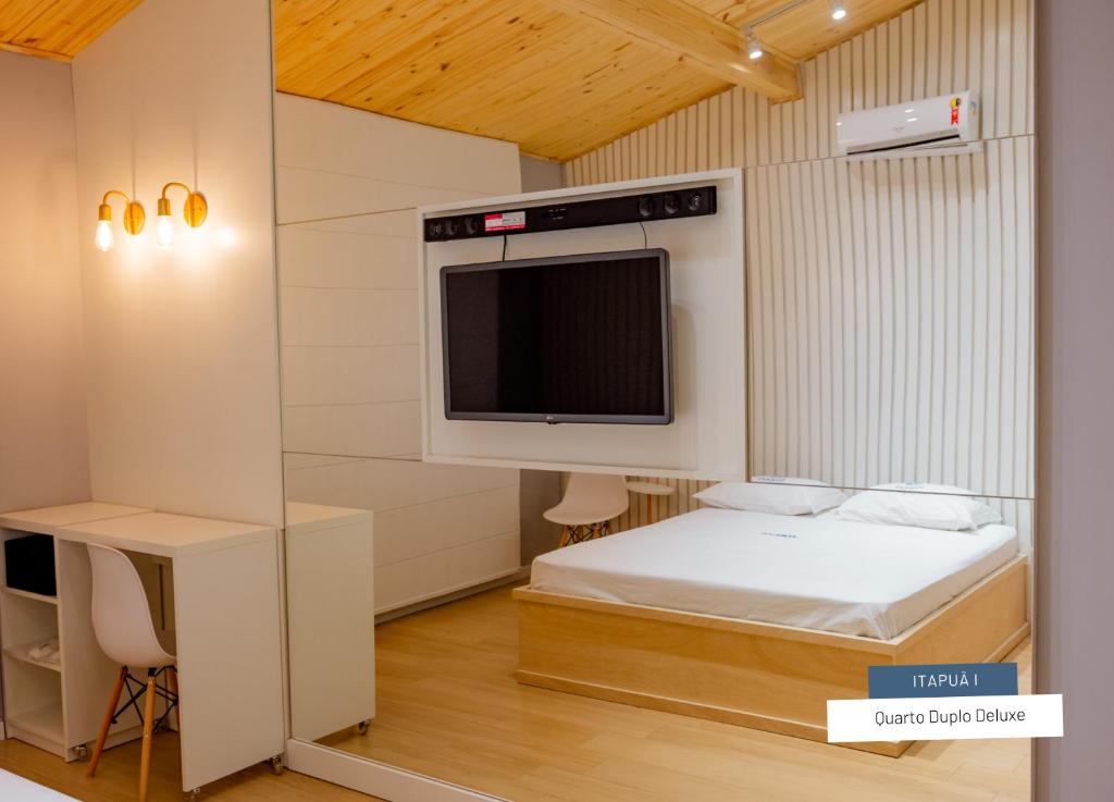 Postel nebo postele na pokoji v ubytování Motel Itapuã I Fx Nova Camobi