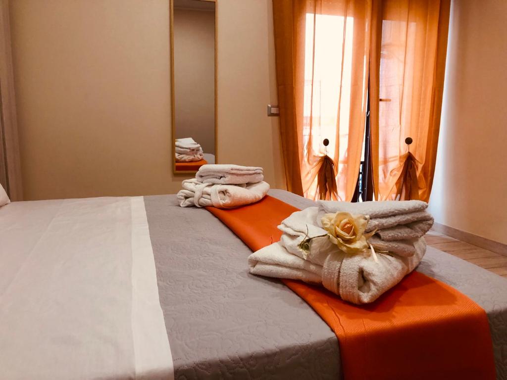 Postel nebo postele na pokoji v ubytování YourHome - La Meta Perfetta Rooms&Spa