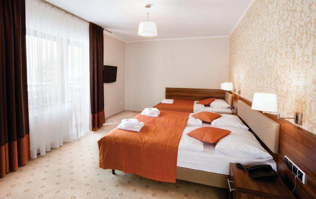 Postel nebo postele na pokoji v ubytování Artus Resort
