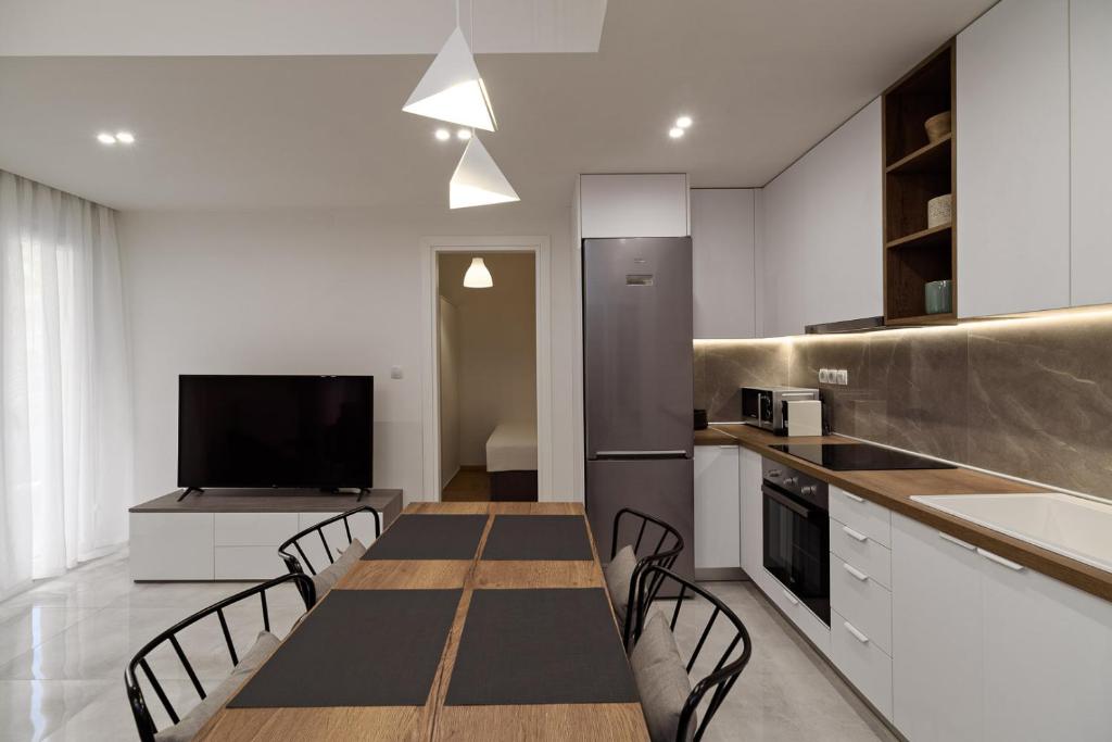Kuchyň nebo kuchyňský kout v ubytování Blu & Marrone Suites-parking included