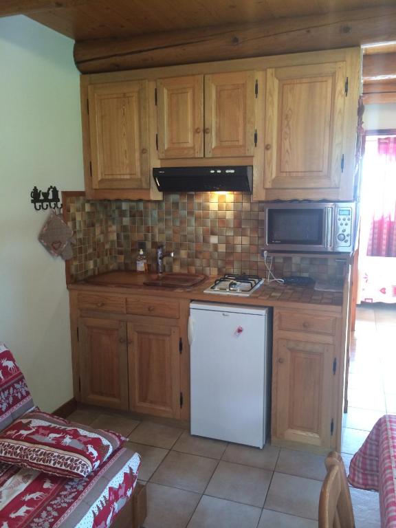 Kuchyň nebo kuchyňský kout v ubytování Appartement Le Cembro