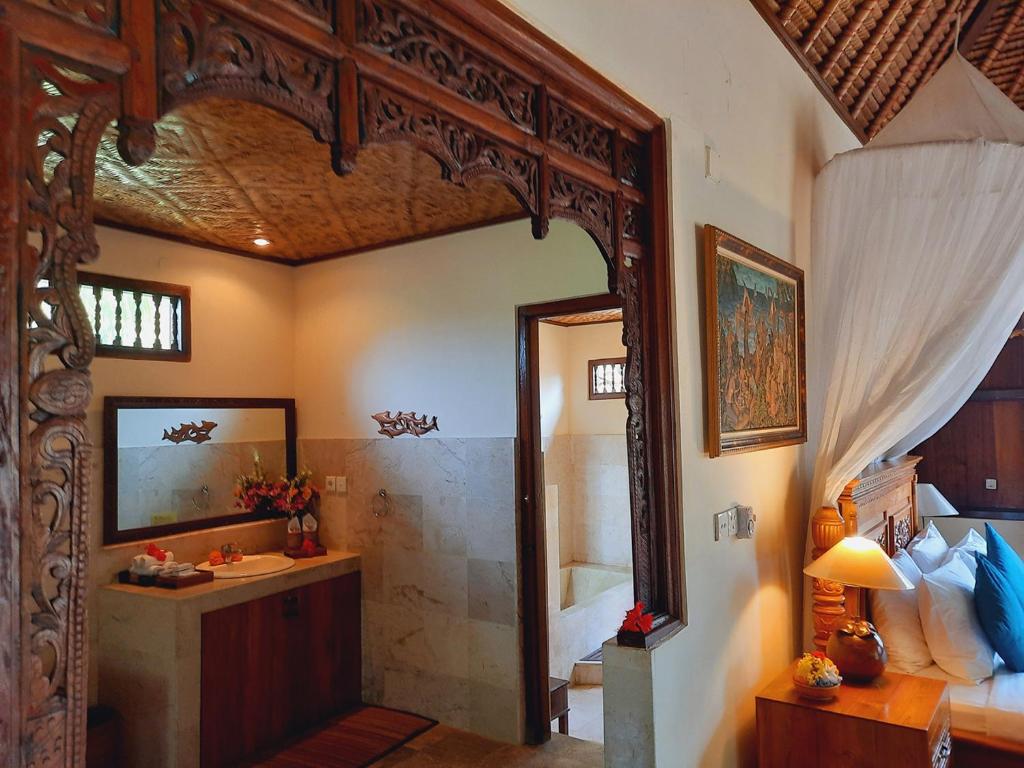 Postel nebo postele na pokoji v ubytování Alam Indah Ubud