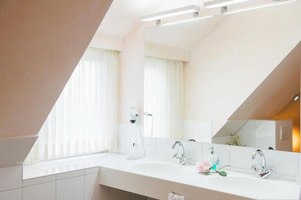 Koupelna v ubytování Hotel Landhaus Höpen