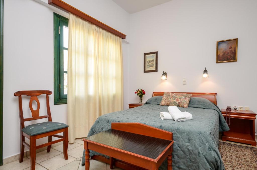 Postel nebo postele na pokoji v ubytování Apollon Hotel