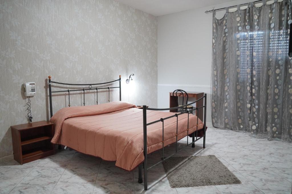 Postel nebo postele na pokoji v ubytování Hotel Stefany