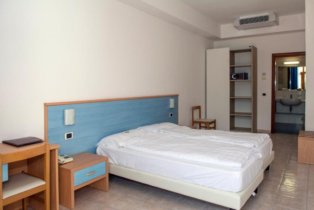 Posteľ alebo postele v izbe v ubytovaní Hotel Coste