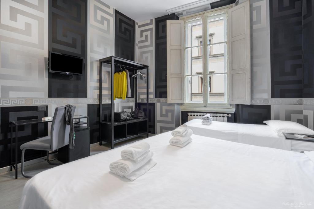 Postel nebo postele na pokoji v ubytování Hotel Spagna