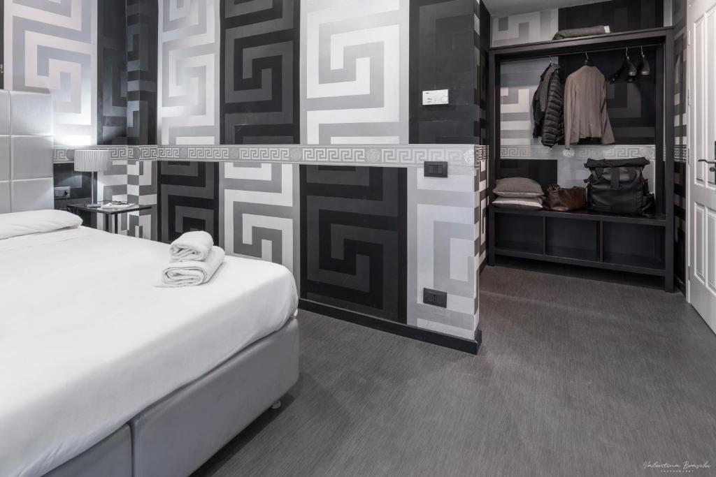 Postel nebo postele na pokoji v ubytování Hotel Spagna