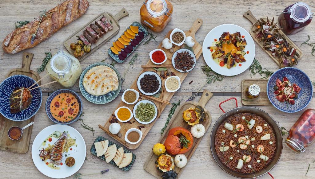 a table with many plates of food on it at Can Salia in San Antonio Bay