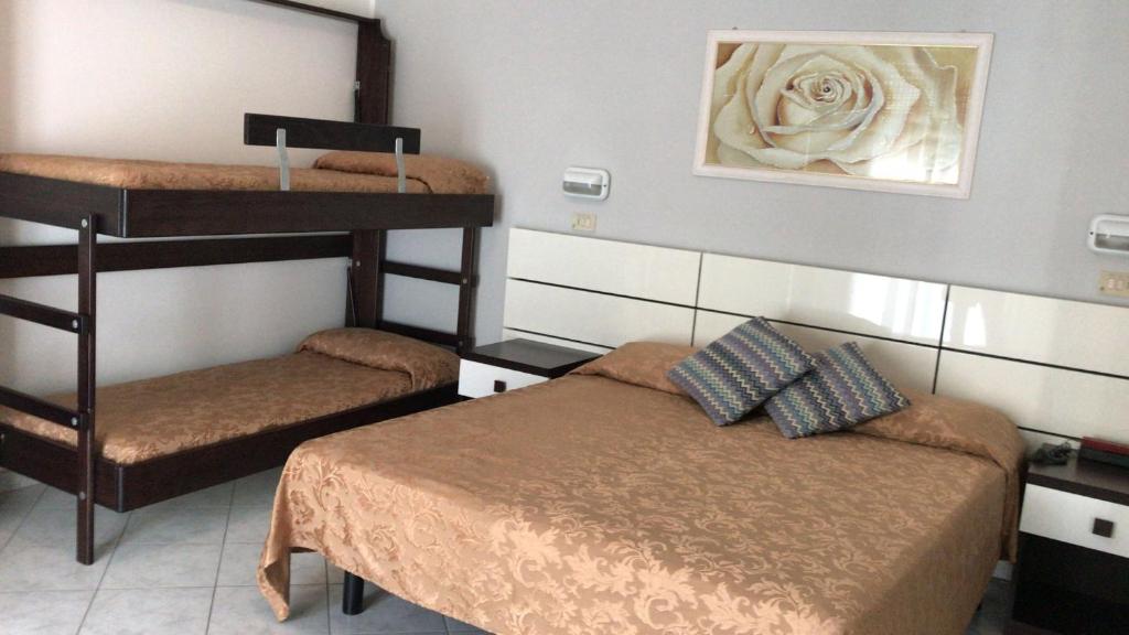 Postel nebo postele na pokoji v ubytování Hotel Des Bains