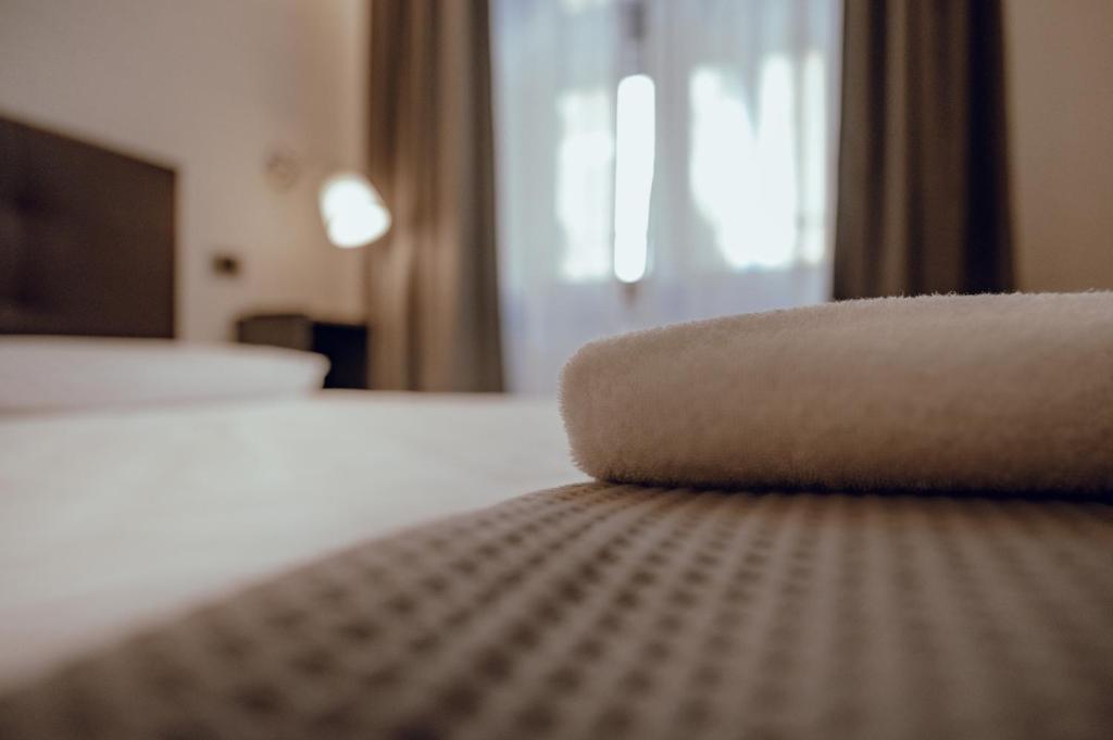 Postel nebo postele na pokoji v ubytování Hotel Francesco