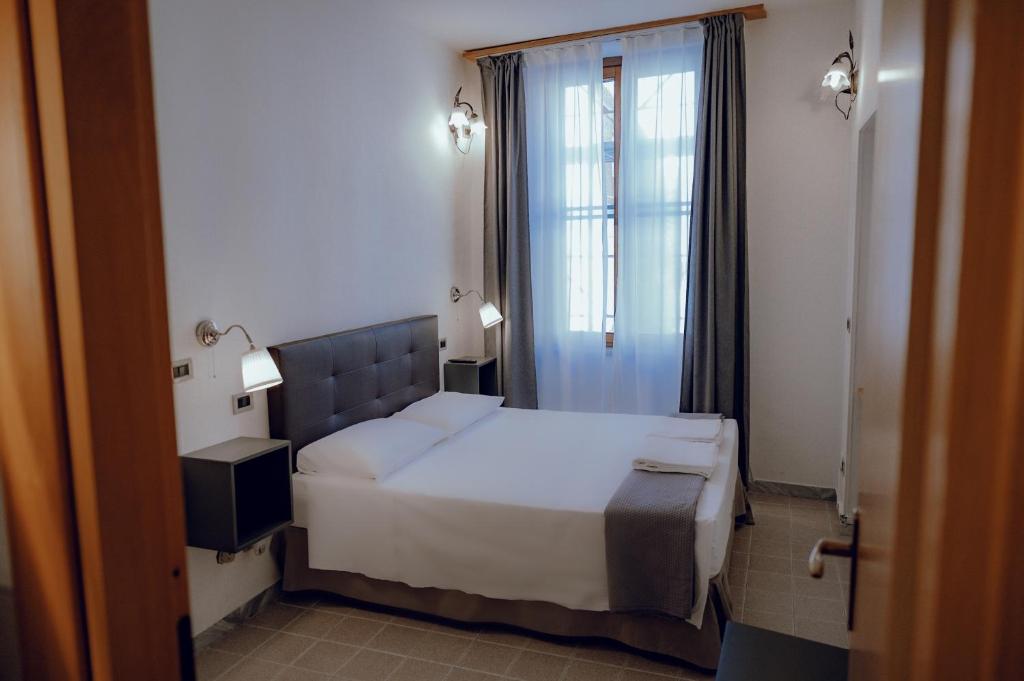 Postel nebo postele na pokoji v ubytování Hotel Francesco