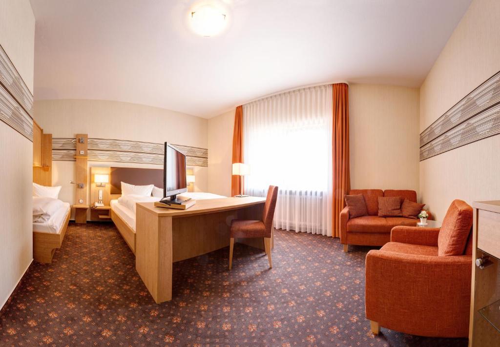 Postel nebo postele na pokoji v ubytování Hotel Fortuna