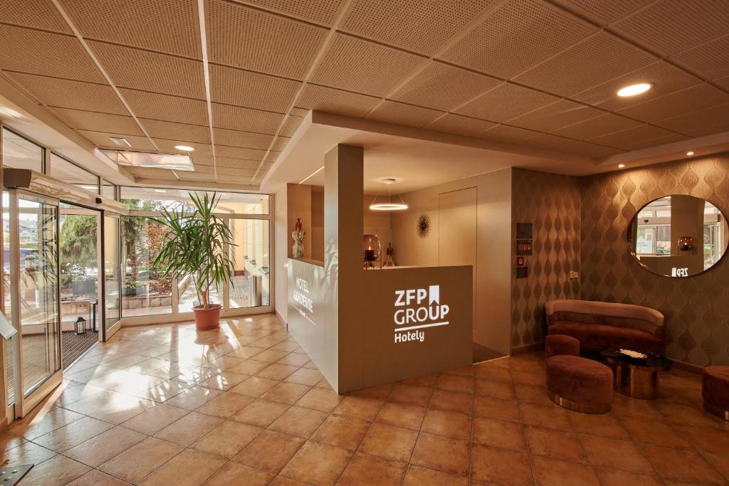 an office lobby with a sign that says ief group at Hotel Akademie a depandance Vila Jarmila in Velké Bílovice