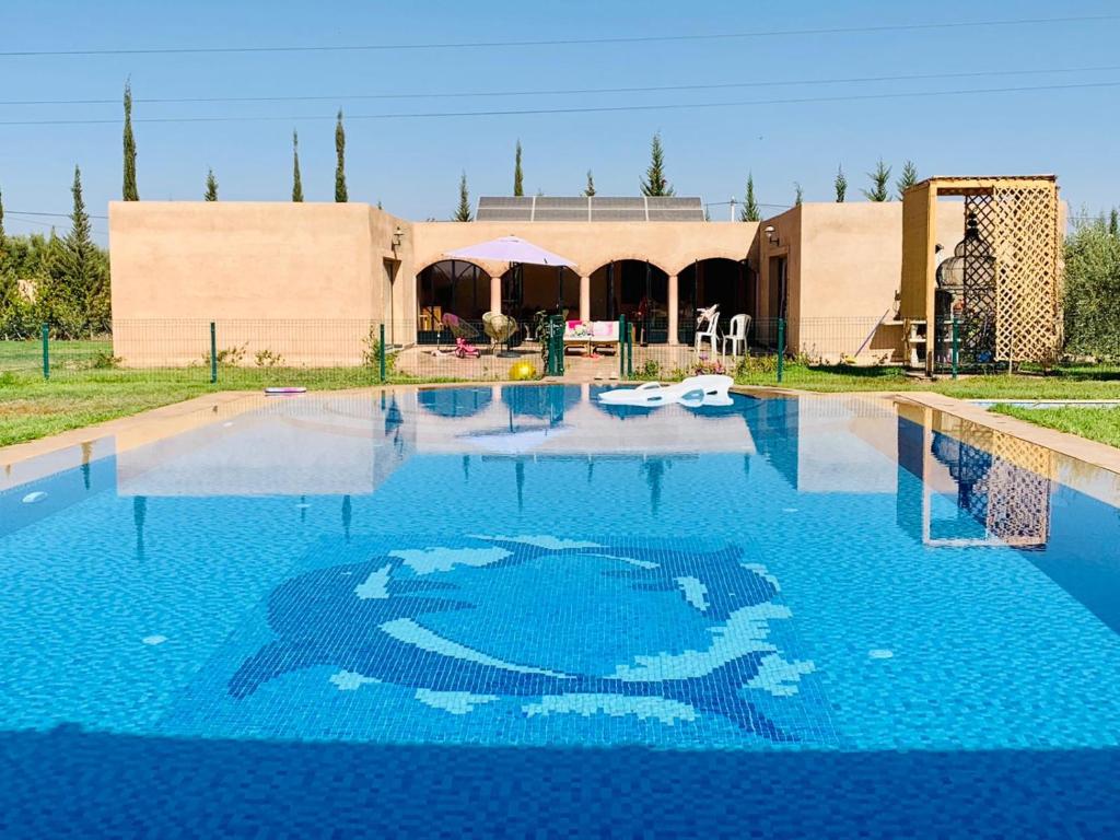 a swimming pool with a painting of a dragon on it at VILLA GIULIA & SOLEY 