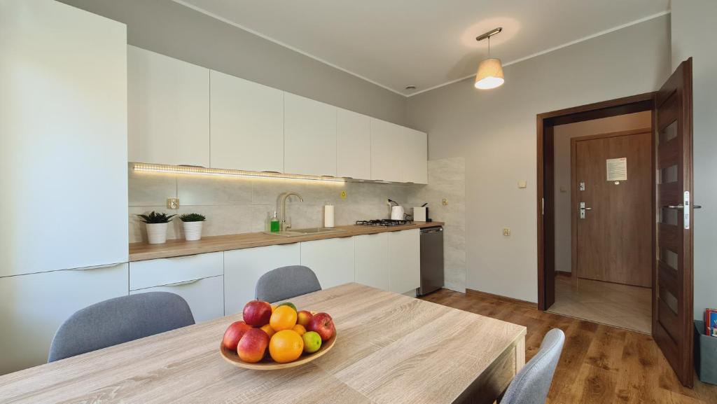Kuchyň nebo kuchyňský kout v ubytování Apartament Parkowy Piątka