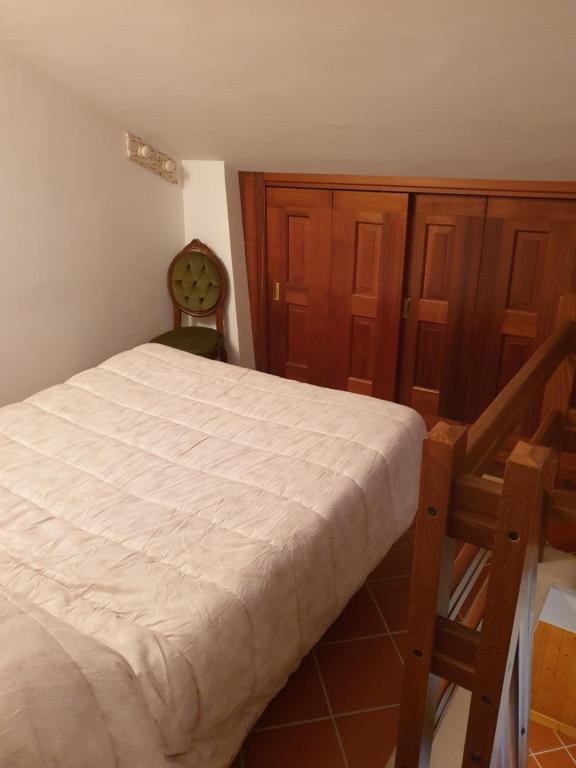 Postel nebo postele na pokoji v ubytování Lo chalet Biancaneve
