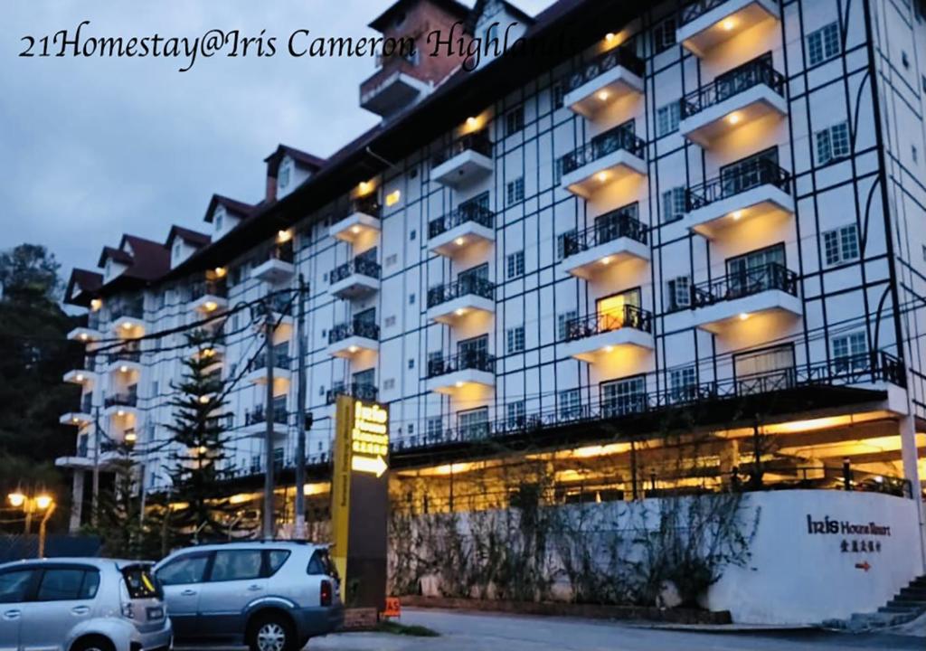 a large building with cars parked in front of it at 21Homestay (3-Bedrooms) @ Iris Cameron Highlands in Cameron Highlands