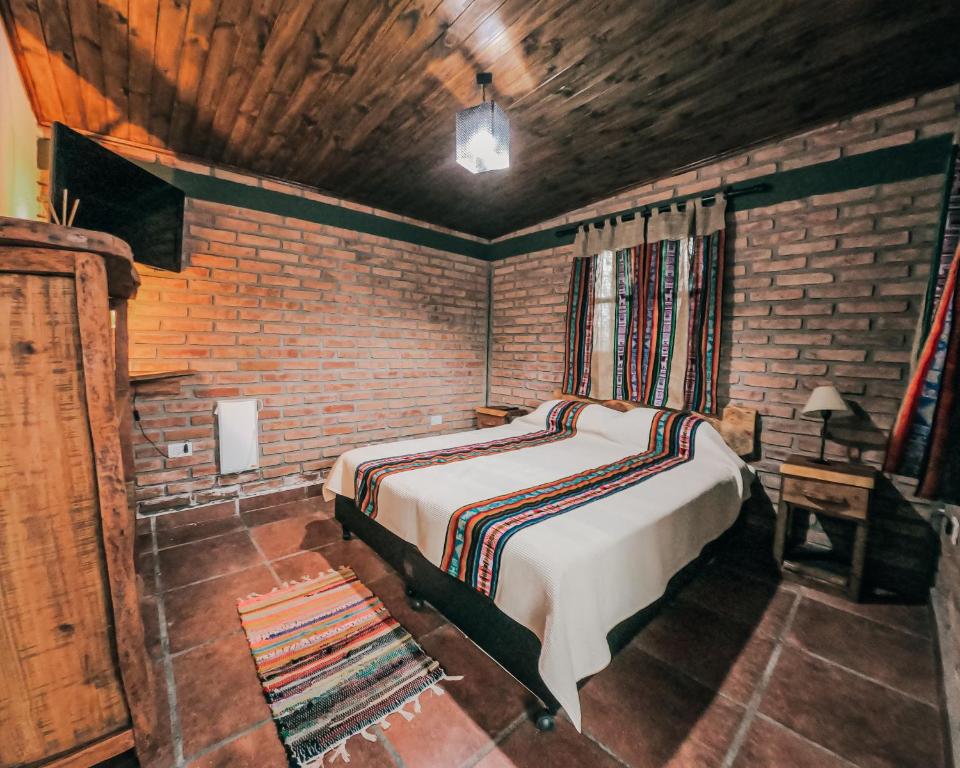 Cama o camas de una habitación en Hostería COMO EN CASA