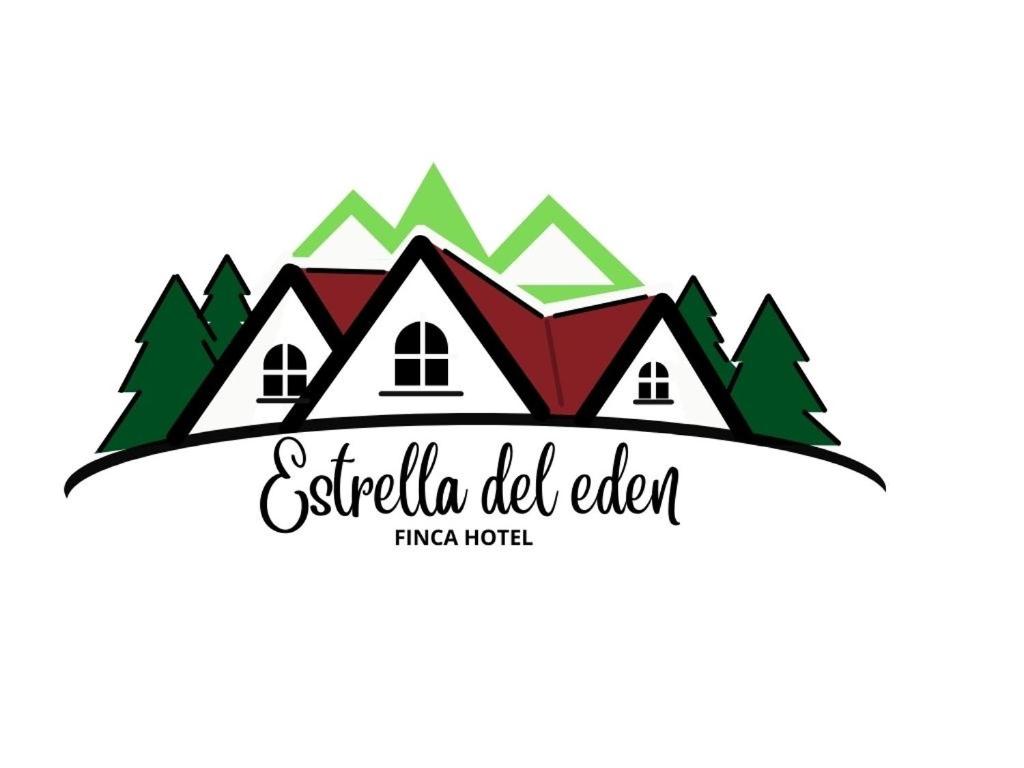 a logo for a real estate agency with houses and trees at Finca Hotel Estrella del Eden in Armenia