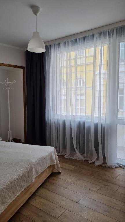 Postel nebo postele na pokoji v ubytování Old Town City Center Apartment