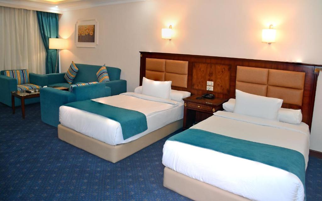 Moon Light Hotel Cairo DAR EL ESHARAにあるベッド