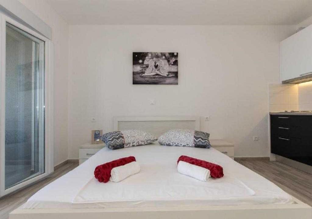Postel nebo postele na pokoji v ubytování Seaview apartments Oscar