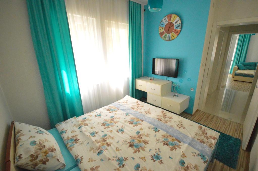 Postel nebo postele na pokoji v ubytování Antonio Apartments