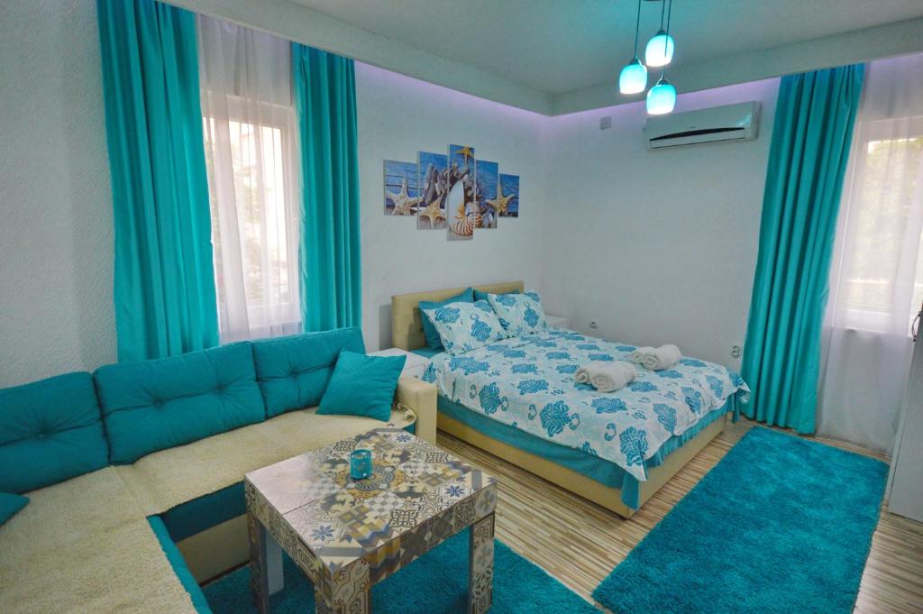 Postel nebo postele na pokoji v ubytování Antonio Apartments
