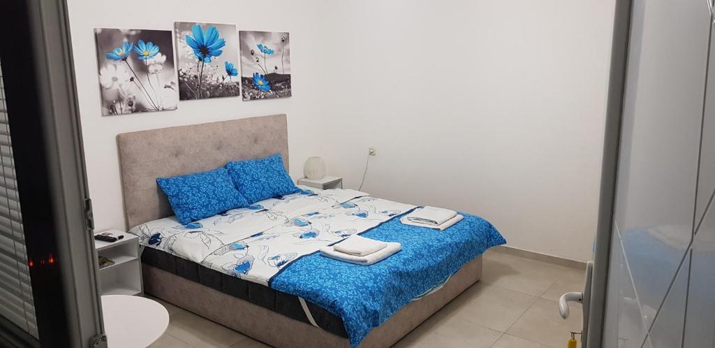 Postel nebo postele na pokoji v ubytování Antonio Apartments