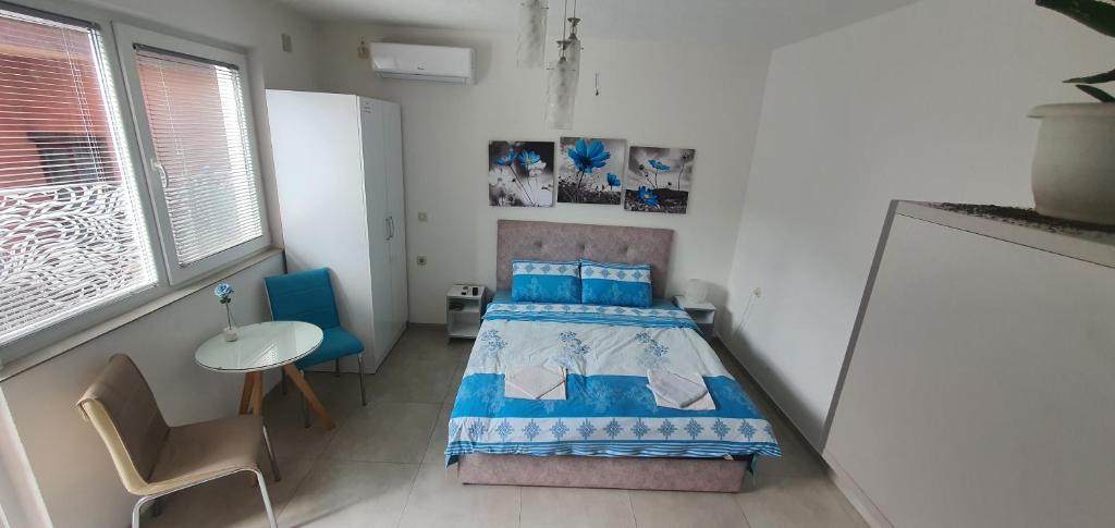 Postel nebo postele na pokoji v ubytování Antonio Apartments