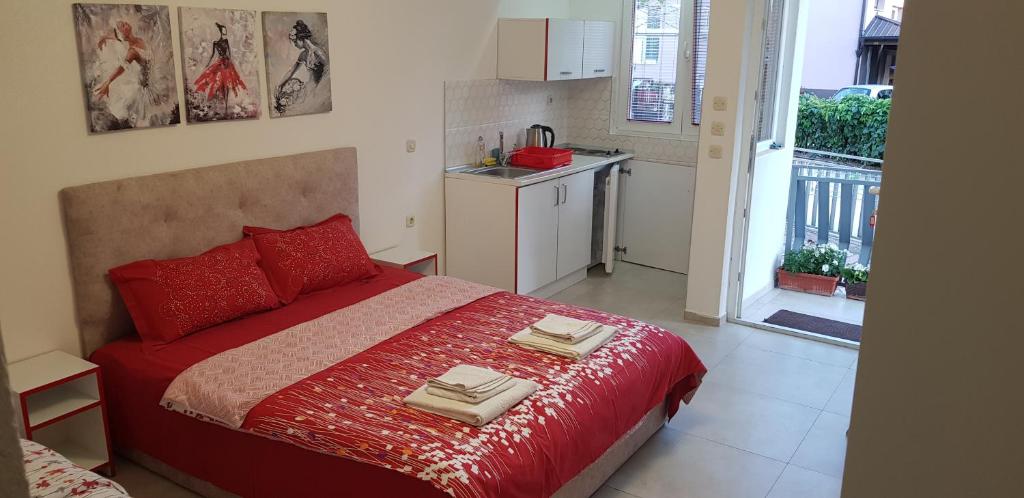 Postel nebo postele na pokoji v ubytování Antonio Apartments