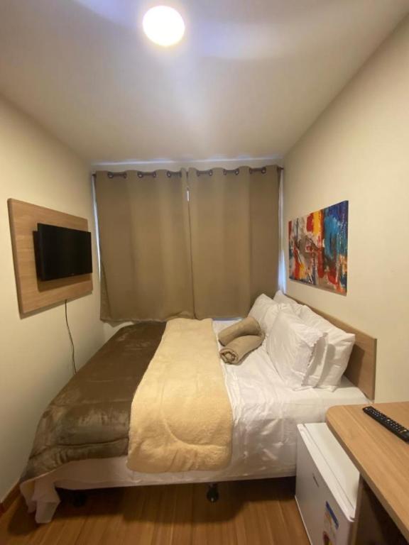 Cama ou camas em um quarto em Pousada HD