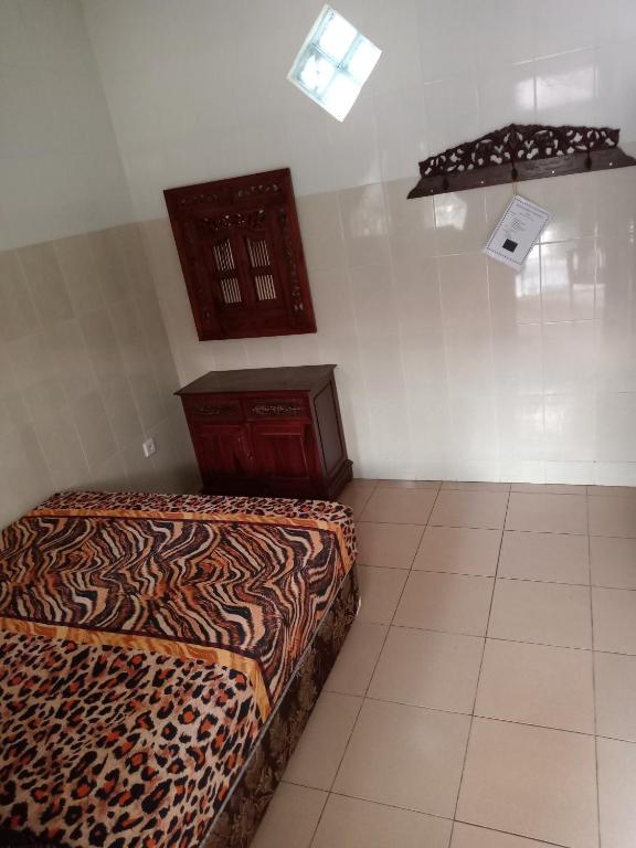 Postel nebo postele na pokoji v ubytování Cempaka 2 Homestay