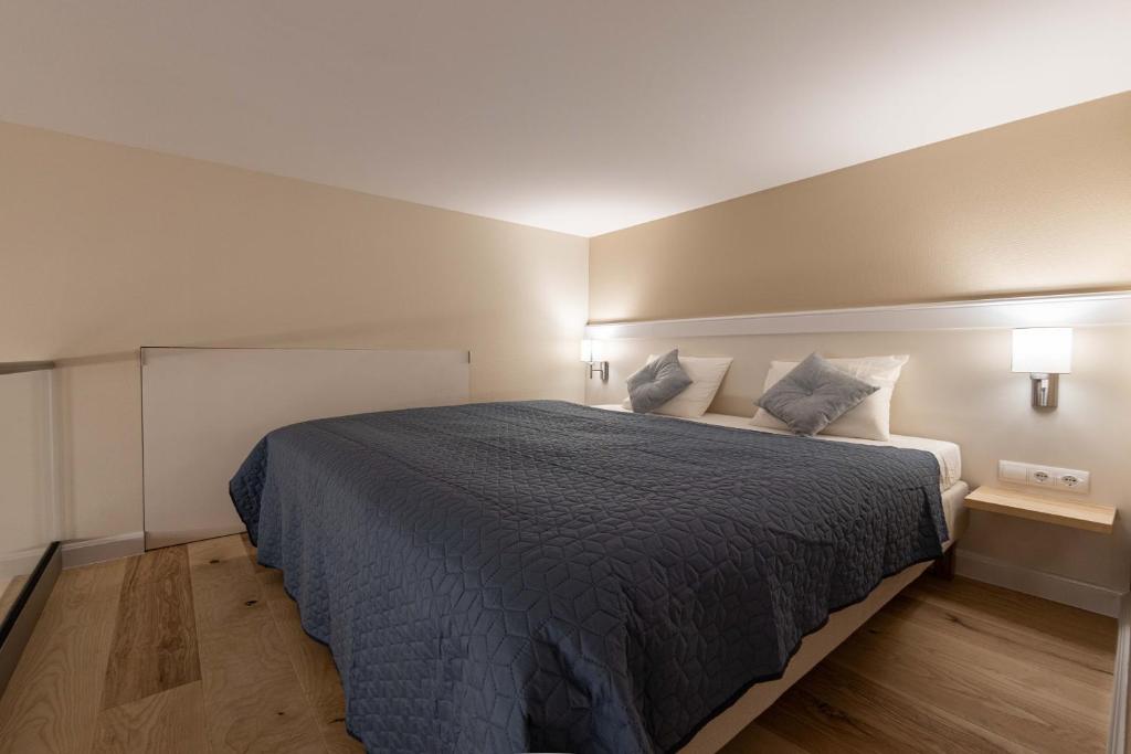 A bed or beds in a room at Ozone One Apartment