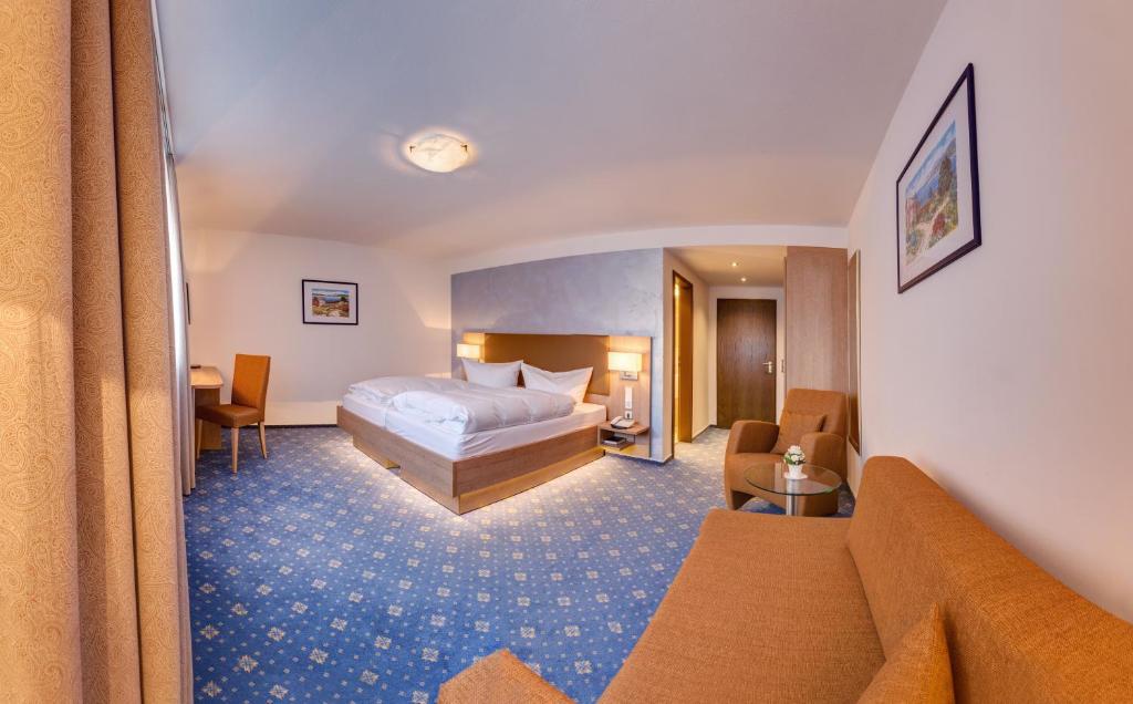 Postel nebo postele na pokoji v ubytování Hotel Fortuna