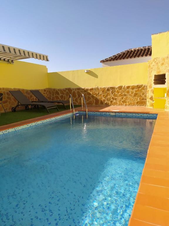 a swimming pool in the middle of a building at LA FUENTE 2 in El Gastor