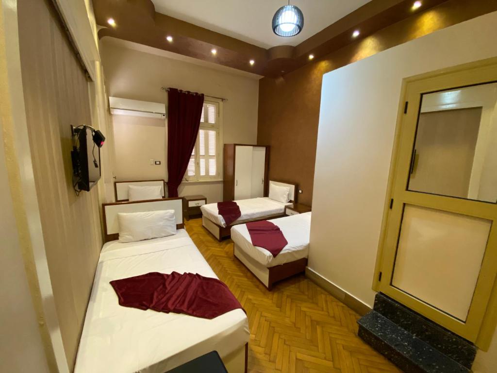 Cama o camas de una habitación en Nour Hostel