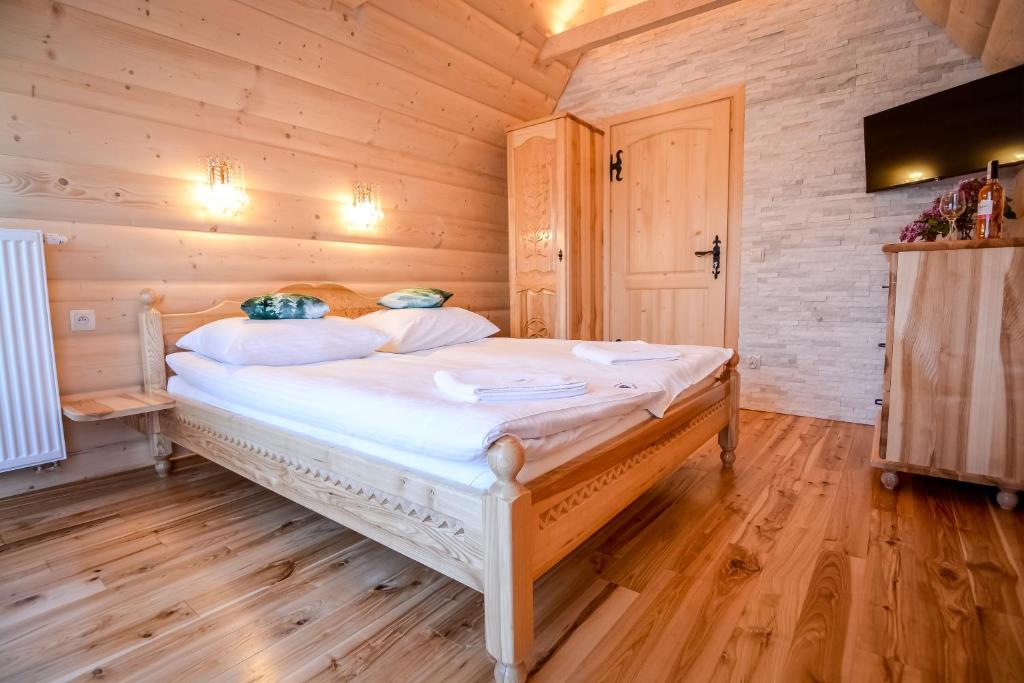 Posteľ alebo postele v izbe v ubytovaní Osada Małe Ciche DOMEK z Bali