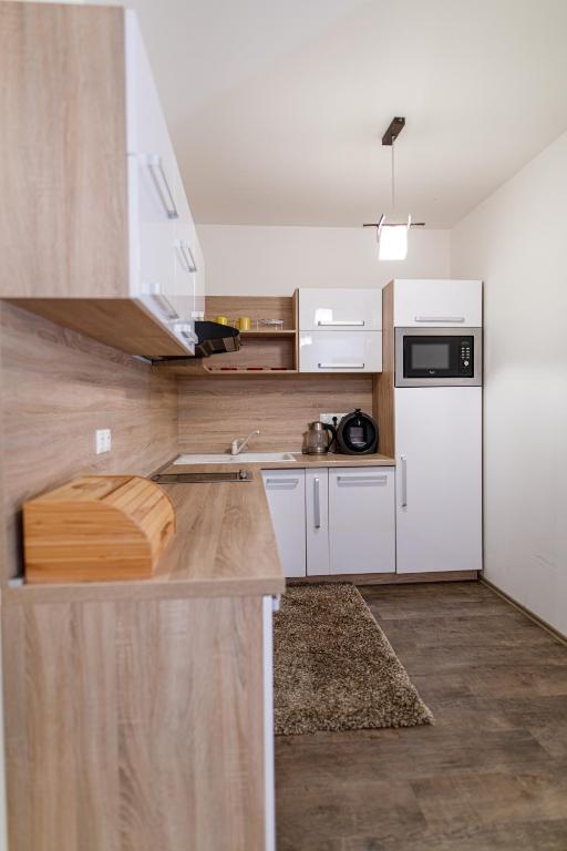 Kuchyň nebo kuchyňský kout v ubytování apartmán ADAM Bystrá Tále