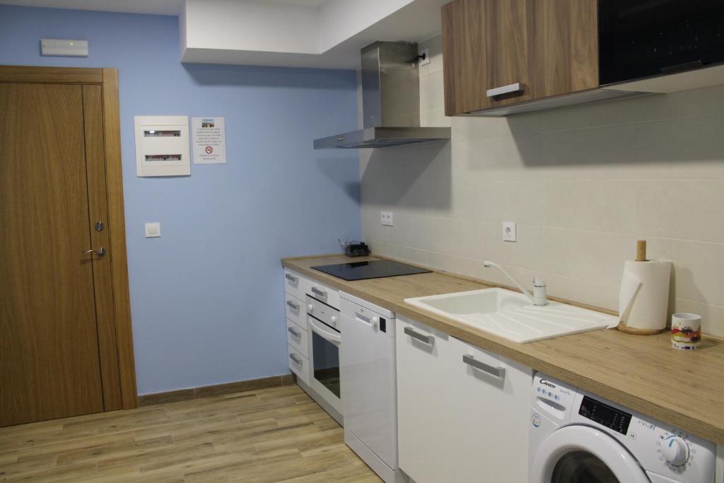 A kitchen or kitchenette at Apartamentos Turísticos ESCORRALADAS