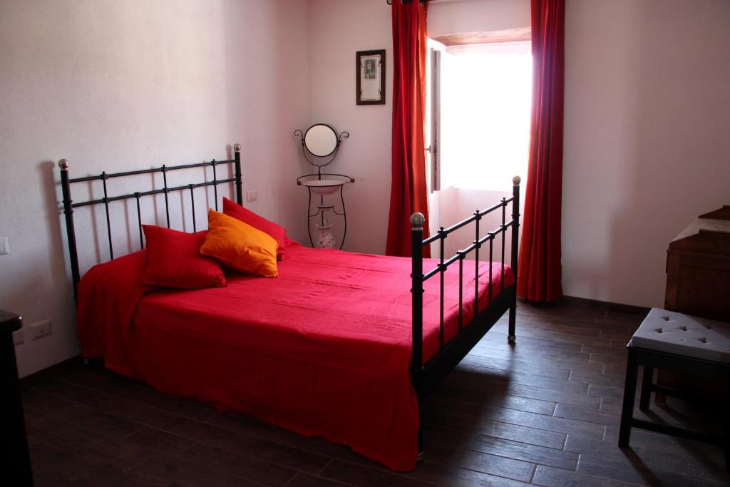 Ένα ή περισσότερα κρεβάτια σε δωμάτιο στο Casetta del Parione