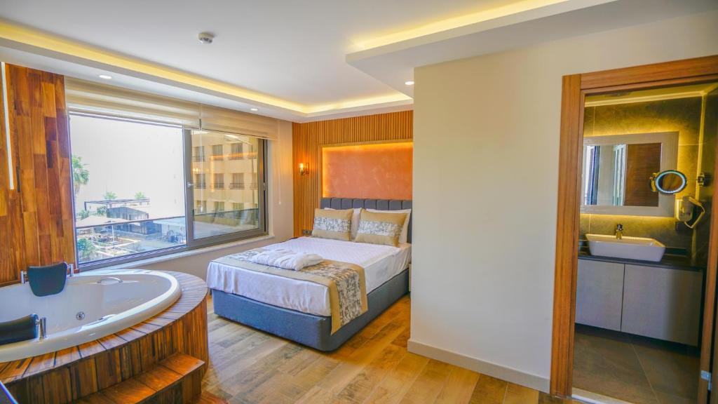 Postel nebo postele na pokoji v ubytování Green Beyza Suites