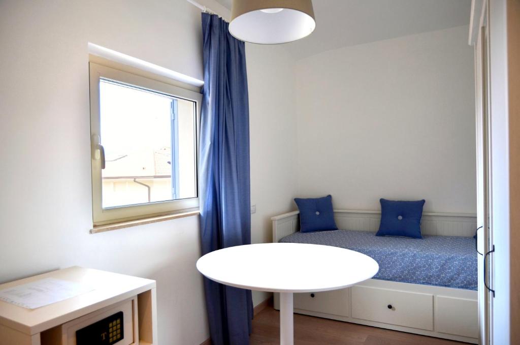 Postel nebo postele na pokoji v ubytování Petit Hotel