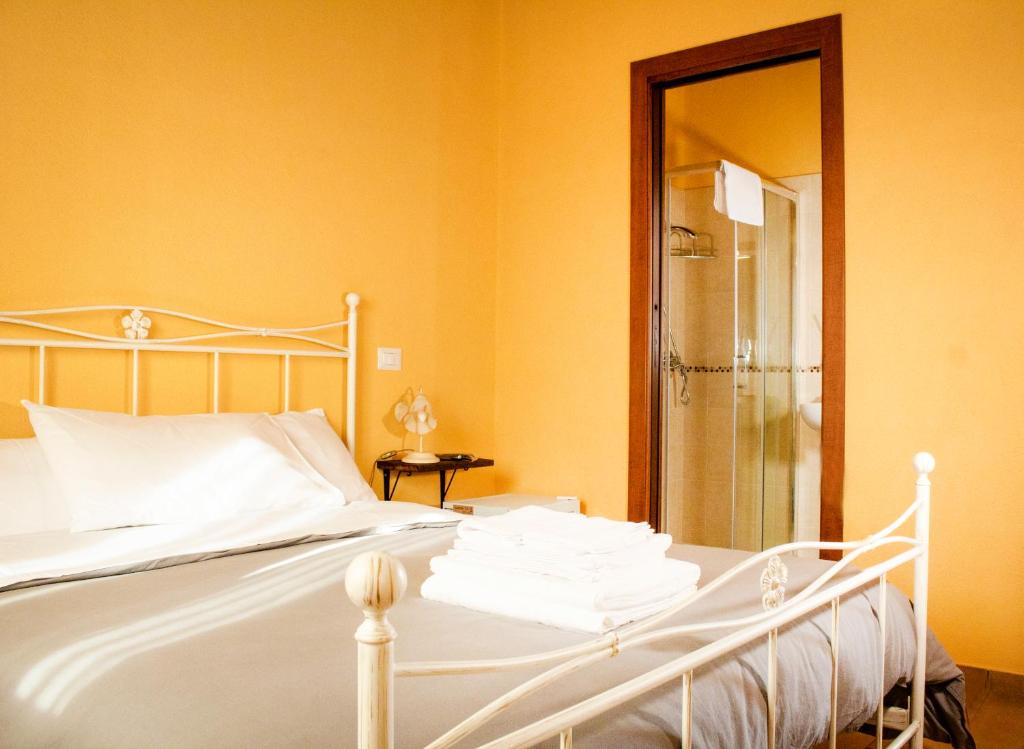 Łóżko lub łóżka w pokoju w obiekcie Agriturismo Poggio Degli Ulivi